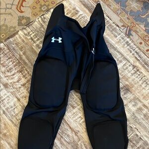 Under Armour Black youth football pads. 7 total pads in the pants. Like new.